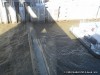 Gates on the lock closing so the water level can lower
