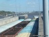 The miter gates opening for the barge to leave
