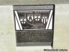 A plaque along the walk to the shrine